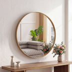 Gold round wall mirror in a styled bathroom setting