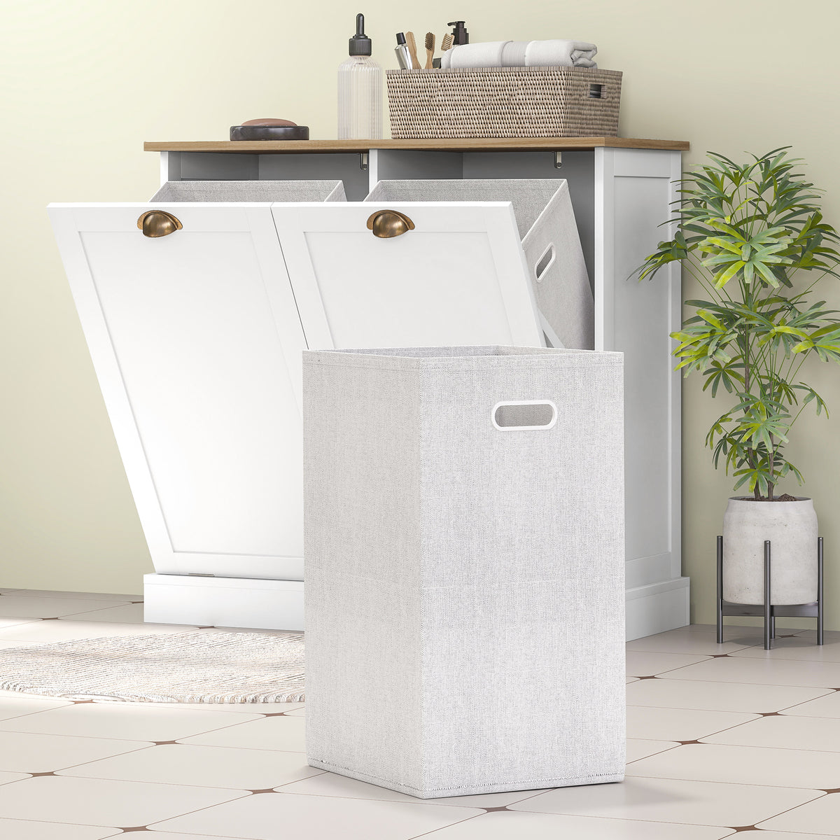 Dual tilt-out laundry cabinet shown in a bathroom