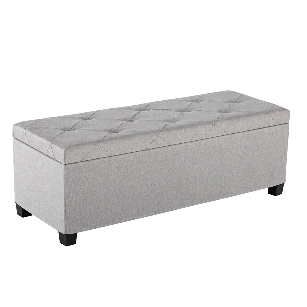 Light gray rectangular upholstered storage ottoman with tufted lid