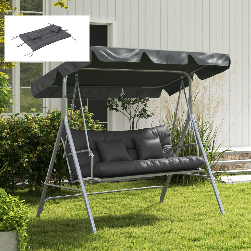 Charcoal tufted bench cushion set on an outdoor swing in a landscaped yard