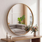 Gold circular mirror showing the slim brushed aluminum frame