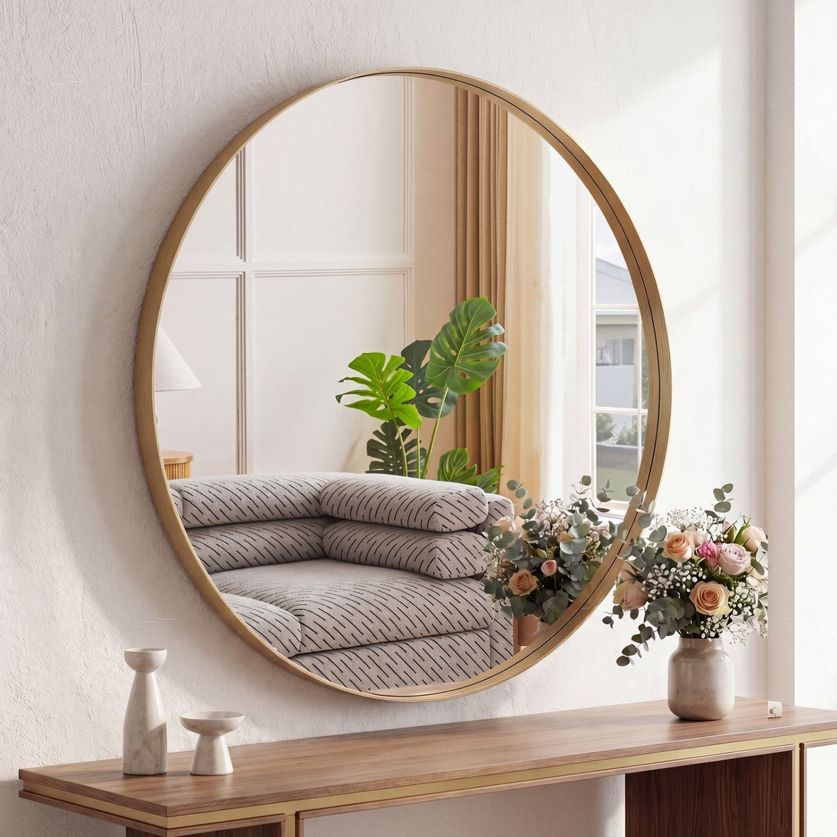 Gold circular mirror showing the slim brushed aluminum frame