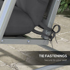 Close-up of charcoal cushion tie fastenings secured around an outdoor swing frame