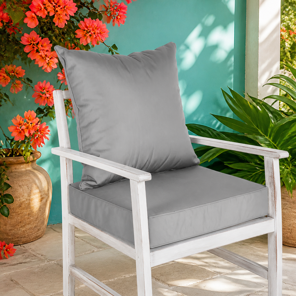 Dark-gray outdoor seat cushion and back pillow set — vibrant primary lifestyle view
