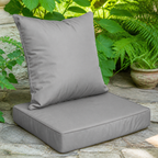 Dark-gray outdoor seat cushion and back pillow set — complementary lifestyle detail view