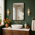 Black rounded rectangular metal wall mirror — vibrant primary product view