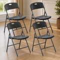 Stackable Folding Chairs — Set of 4, Black in a colorful contemporary setting