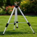 Adjustable Tripod Lawn Sprinkler — Gray in a colorful realistic setting