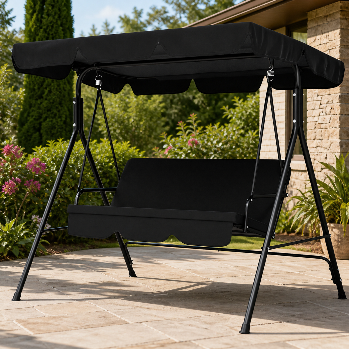 Three-Seat Patio Swing with Adjustable Canopy — Black in a colorful realistic setting